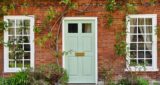 Maverick Woman Paints Front Door Green